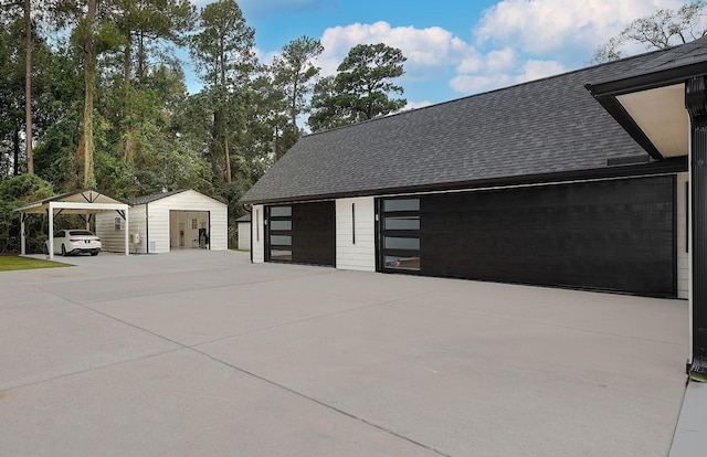 15232 Saddlewood Dr, Conroe, TX 77384 - detached garage with a carport and a shed