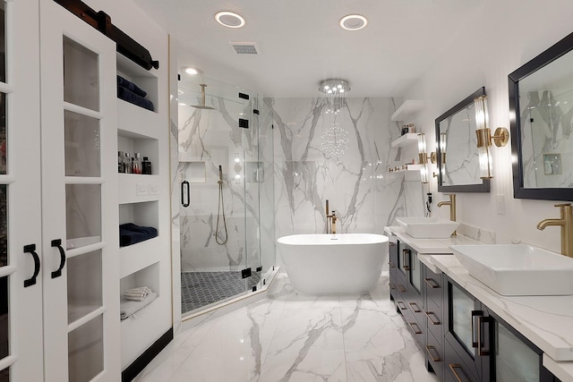 15232 Saddlewood Dr, Conroe, TX 77384 - bathroom with a marble finish shower, marble tiled floors, a freestanding bath, recessed lighting, and double vanity