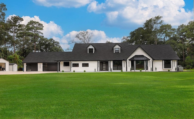 15232 Saddlewood Dr, Conroe, TX 77384 - view of front facade with a front yard, cooling unit, driveway, and roof with shingles