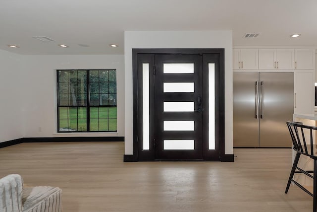 15232 Saddlewood Dr, Conroe, TX 77384 - foyer entrance featuring light wood-type flooring and recessed lighting