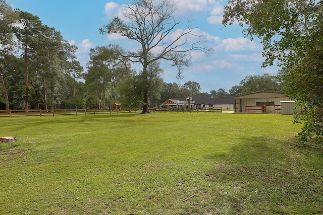 15232 Saddlewood Dr, Conroe, TX 77384 - view of yard with an outbuilding and a garage