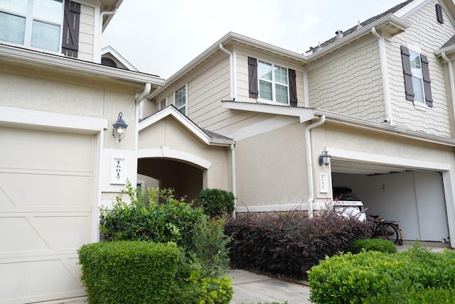 16019 Summerville Lake Dr, Tomball, TX 77377 - view of property exterior featuring an attached garage and stucco siding