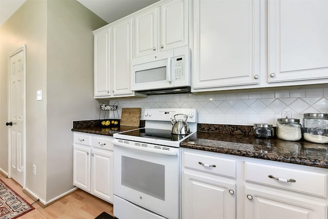 17006 Valley Palms Dr, Spring, TX 77379 - kitchen featuring white appliances, backsplash, white cabinetry, and light wood-style floors