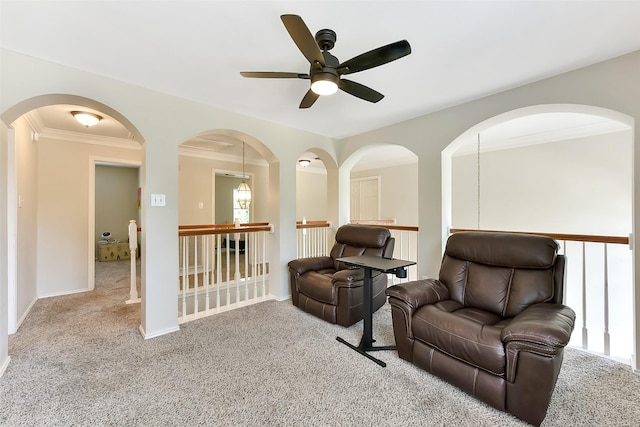 17006 Valley Palms Dr, Spring, TX 77379 - living area featuring carpet flooring, ceiling fan, an upstairs landing, ornamental molding, and baseboards