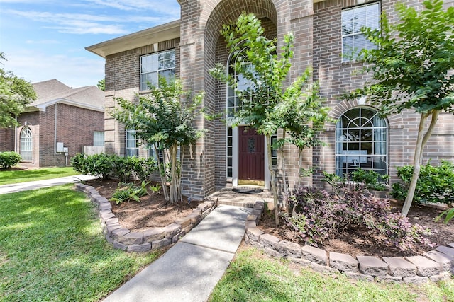 17006 Valley Palms Dr, Spring, TX 77379 - doorway to property with brick siding and a lawn