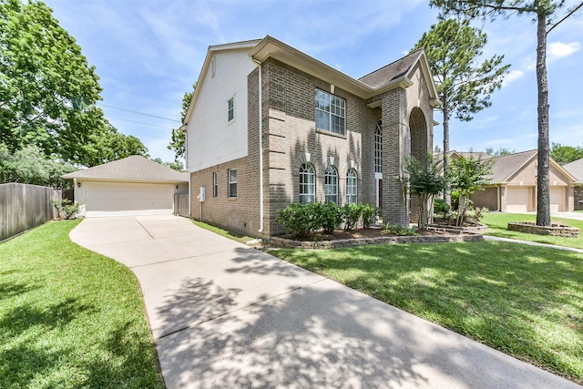 17006 Valley Palms Dr, Spring, TX 77379 - traditional-style home with brick siding, an outbuilding, and a detached garage