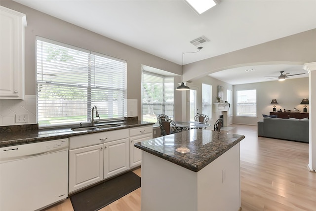 17006 Valley Palms Dr, Spring, TX 77379 - kitchen featuring dishwasher, a sink, a fireplace, a center island, and a ceiling fan