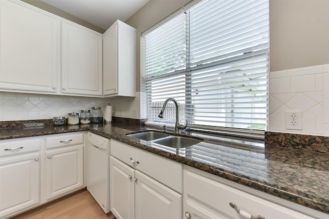 17006 Valley Palms Dr, Spring, TX 77379 - kitchen with a sink, white dishwasher, white cabinets, dark stone counters, and tasteful backsplash