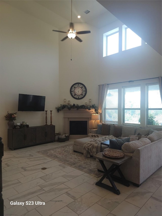 1013 Goose Creek St, Webster, TX 77598 - living room featuring light marble finish floors, plenty of natural light, and a high ceiling