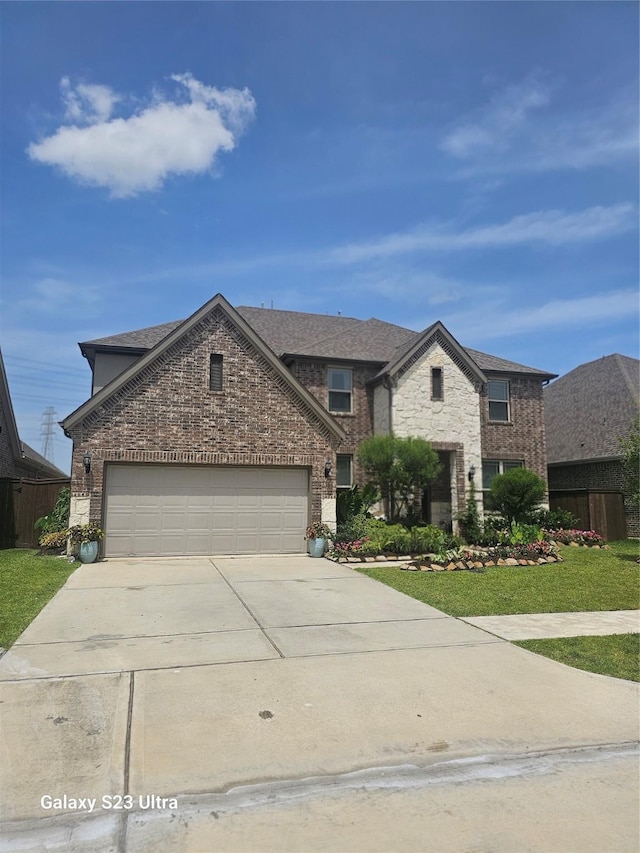 1013 Goose Creek St, Webster, TX 77598 - traditional-style house with driveway, an attached garage, brick siding, a front yard, and a shingled roof