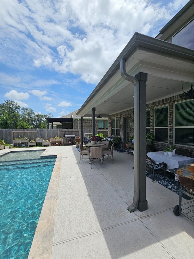 1013 Goose Creek St, Webster, TX 77598 - view of pool with outdoor dining space, a patio, and an outdoor hangout area