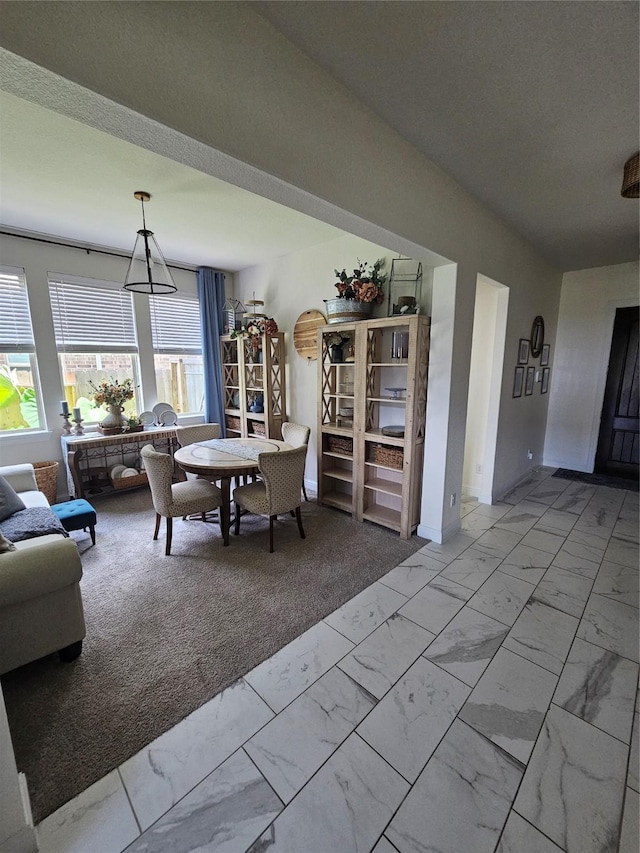 1013 Goose Creek St, Webster, TX 77598 - dining room featuring light marble finish floors