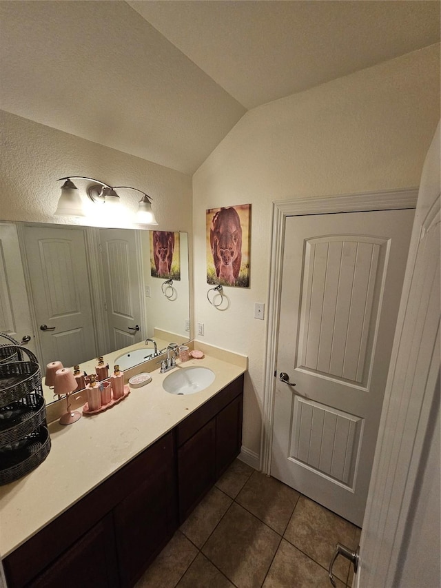 1013 Goose Creek St, Webster, TX 77598 - bathroom featuring lofted ceiling, tile patterned flooring, and vanity