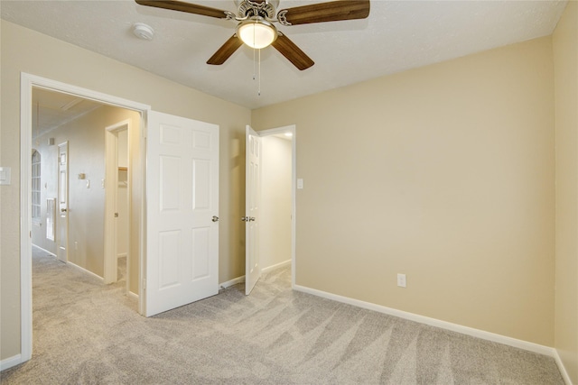 10900 Spruce Dr N, La Porte, TX 77571 - unfurnished bedroom with carpet, baseboards, and ceiling fan