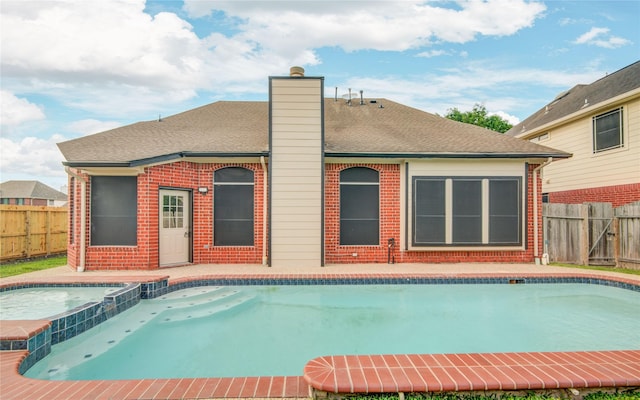10900 Spruce Dr N, La Porte, TX 77571 - view of swimming pool with a fenced backyard and a pool with connected hot tub