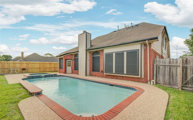 10900 Spruce Dr N, La Porte, TX 77571 - view of swimming pool featuring a fenced backyard, a pool with connected hot tub, and a patio