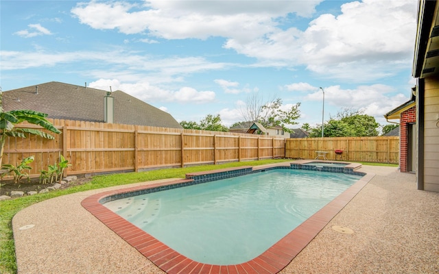 10900 Spruce Dr N, La Porte, TX 77571 - view of swimming pool featuring a fenced backyard, a pool with connected hot tub, and a patio