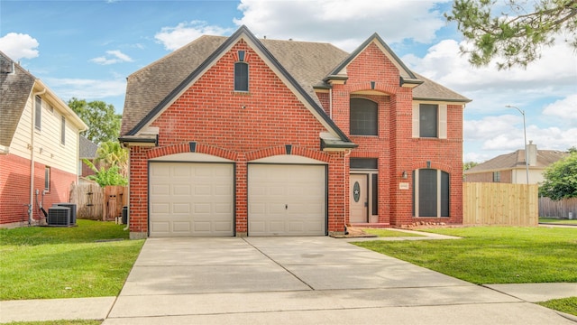 10900 Spruce Dr N, La Porte, TX 77571 - view of front of property featuring brick siding, concrete driveway, and a shingled roof
