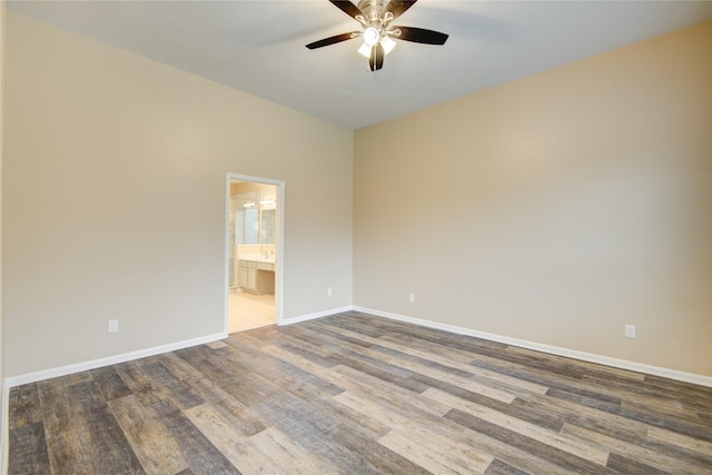 10900 Spruce Dr N, La Porte, TX 77571 - spare room featuring wood finished floors, ceiling fan, and baseboards