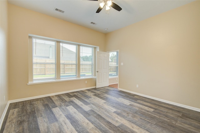 10900 Spruce Dr N, La Porte, TX 77571 - unfurnished room with dark wood finished floors, a ceiling fan, and baseboards