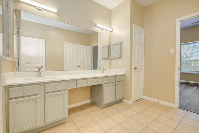 10900 Spruce Dr N, La Porte, TX 77571 - full bath with double vanity, tile patterned flooring, and baseboards
