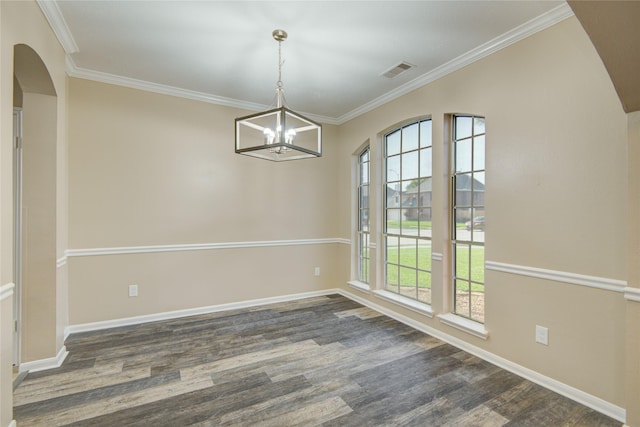 10900 Spruce Dr N, La Porte, TX 77571 - unfurnished room with a chandelier, arched walkways, crown molding, dark wood-style floors, and baseboards