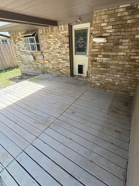 wooden deck featuring fence