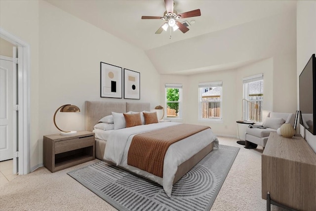 bedroom with light carpet, vaulted ceiling, ceiling fan, and baseboards