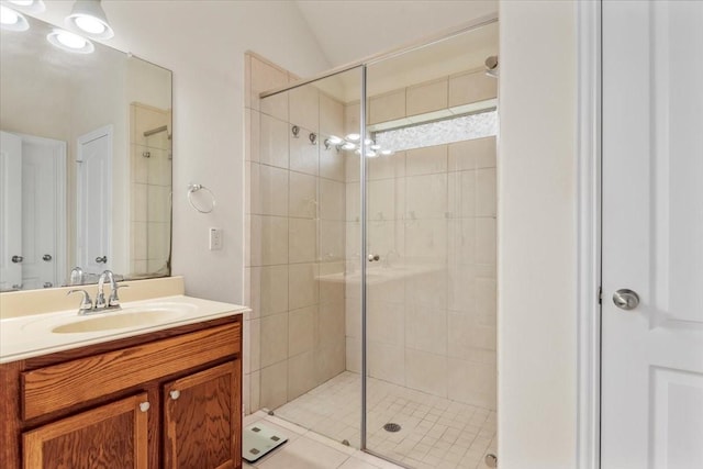 bathroom featuring a stall shower and vanity