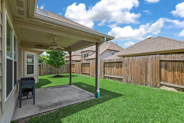 view of yard featuring ceiling fan and a patio area