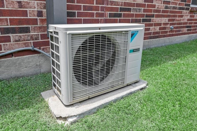 exterior view of ac unit and brick siding