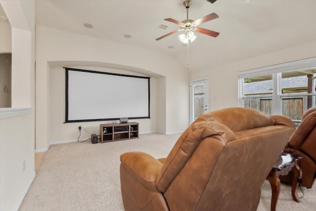 cinema room featuring carpet floors, lofted ceiling, a ceiling fan, and baseboards