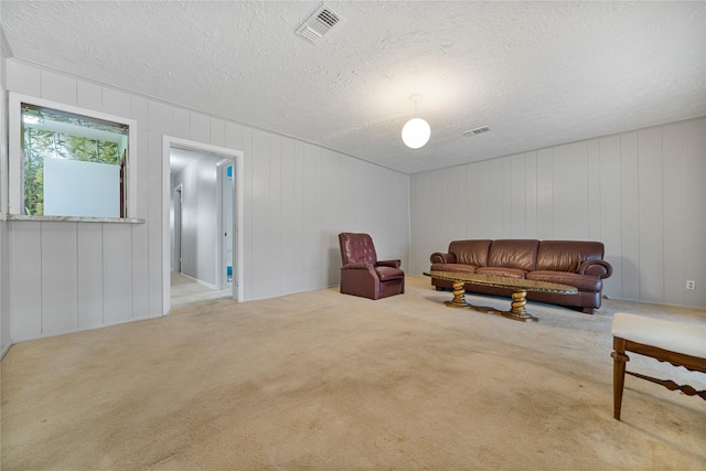 5402 Tallow Ln, Houston, TX 77021 - carpeted living area with a textured ceiling
