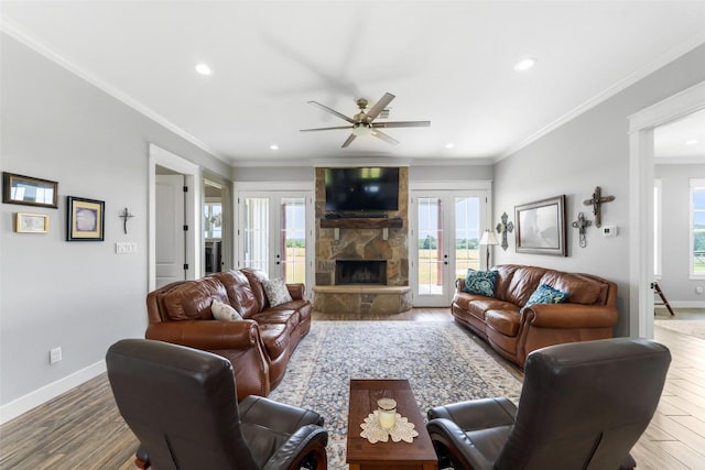 3785 County Road 405, Anderson, TX 77830 - living room featuring a stone fireplace, recessed lighting, wood finished floors, baseboards, and french doors