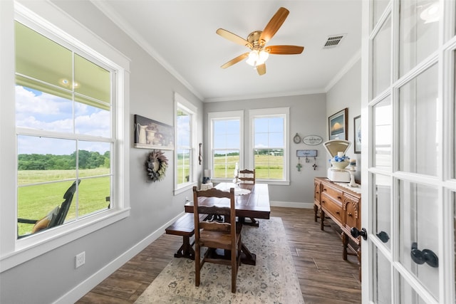 3785 County Road 405, Anderson, TX 77830 - dining area with crown molding, baseboards, dark wood finished floors, and a ceiling fan