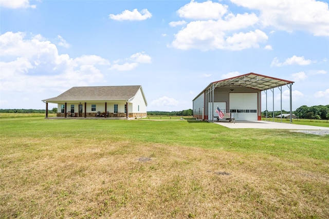 3785 County Road 405, Anderson, TX 77830 - view of front facade with a front lawn, an outbuilding, driveway, and a garage