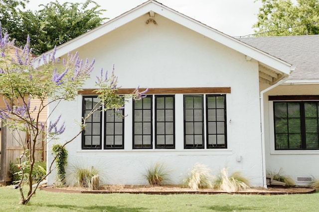 713 Usener St, Houston, TX 77009 - view of property exterior with stucco siding and a shingled roof