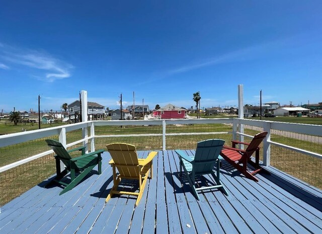 1019 Treaty Dr, Surfside Beach, TX 77541 - wooden terrace with a lawn