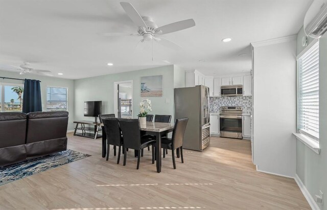 1019 Treaty Dr, Surfside Beach, TX 77541 - dining space featuring a ceiling fan, a wall mounted air conditioner, light wood-style floors, and recessed lighting
