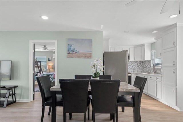 1019 Treaty Dr, Surfside Beach, TX 77541 - dining space featuring light wood-style floors, ceiling fan, recessed lighting, and baseboards