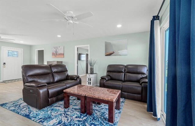 1019 Treaty Dr, Surfside Beach, TX 77541 - living room with ceiling fan, recessed lighting, light wood-type flooring, and baseboards