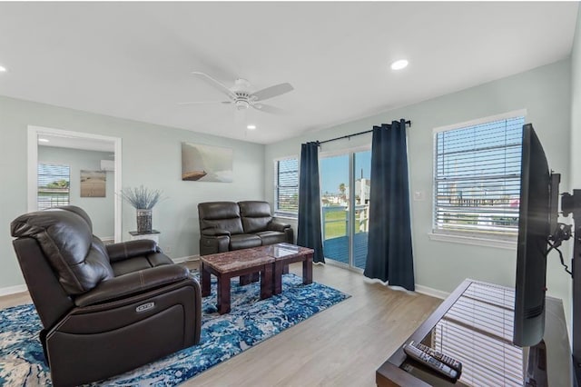 1019 Treaty Dr, Surfside Beach, TX 77541 - living room with ceiling fan, healthy amount of natural light, baseboards, wood finished floors, and recessed lighting