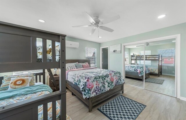 1019 Treaty Dr, Surfside Beach, TX 77541 - bedroom featuring multiple windows, wood finished floors, ceiling fan, recessed lighting, and baseboards