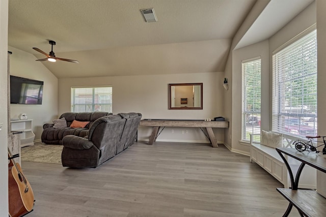 3729 Breckenridge Dr, Montgomery, TX 77356 - living area with lofted ceiling, light wood-style floors, plenty of natural light, and a ceiling fan