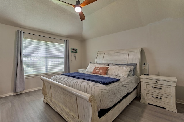 3729 Breckenridge Dr, Montgomery, TX 77356 - bedroom featuring wood finished floors, baseboards, vaulted ceiling, and a ceiling fan