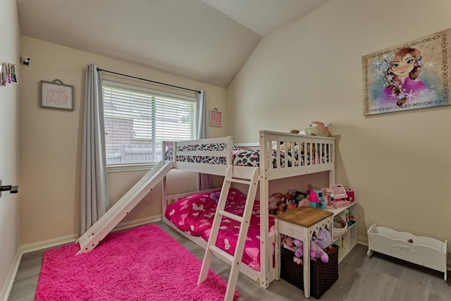 3729 Breckenridge Dr, Montgomery, TX 77356 - bedroom with wood finished floors, vaulted ceiling, and baseboards