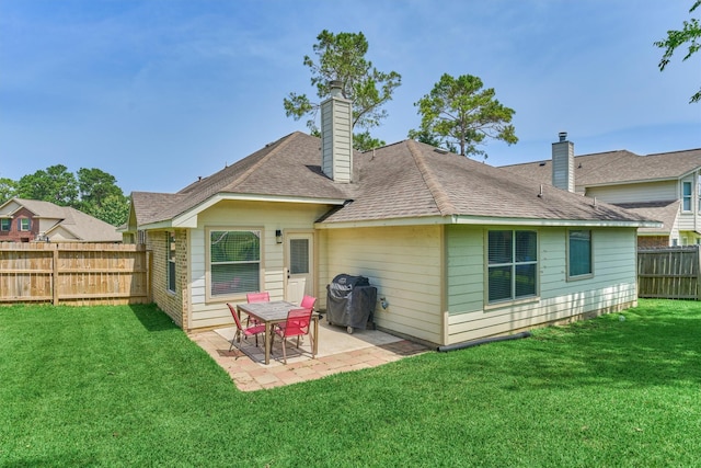 3729 Breckenridge Dr, Montgomery, TX 77356 - rear view of house featuring a patio, a shingled roof, and a chimney