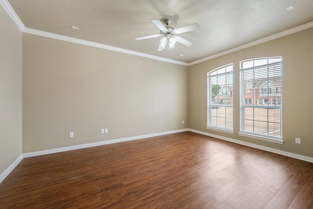 1001 Krenek Tap Rd Unit 1501, College Station, TX 77840 - spare room featuring dark wood-style flooring, baseboards, a ceiling fan, and crown molding