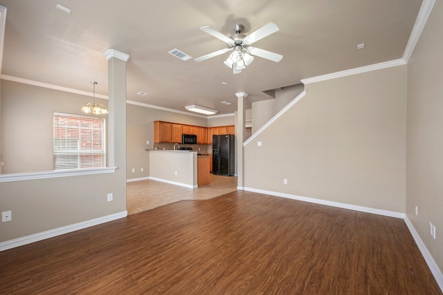 1001 Krenek Tap Rd Unit 1501, College Station, TX 77840 - unfurnished living room with ceiling fan, a chandelier, wood finished floors, baseboards, and ornamental molding