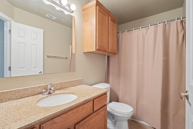 1001 Krenek Tap Rd Unit 1501, College Station, TX 77840 - bathroom with toilet, vanity, and tile patterned flooring